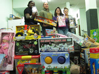 Guido Sanchez and Tony Perlstein drop off toys for Bayonne Kids